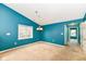 Cozy living room with view of chandelier, window, and hall at 229 Waterford Ct, Avon, IN 46123