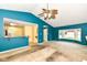 Open living room with an adjacent kitchen and a large bay window at 229 Waterford Ct, Avon, IN 46123