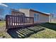 Backyard view with a deck, green grass, and view of siding on a home at 2606 Bristlecone Dr, Indianapolis, IN 46217