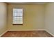 Bedroom features tan carpet, a window with blinds, and neutral-toned walls at 2606 Bristlecone Dr, Indianapolis, IN 46217