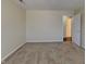 Empty bedroom with neutral carpet and easy access to the hall at 2606 Bristlecone Dr, Indianapolis, IN 46217