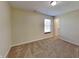 Bedroom featuring a window, closet with door and neutral carpeting throughout at 2606 Bristlecone Dr, Indianapolis, IN 46217