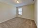 Bedroom featuring neutral carpet, window with blinds, and neutral-toned walls at 2606 Bristlecone Dr, Indianapolis, IN 46217