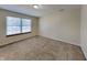 Comfortable bedroom with large window and neutral carpet at 2606 Bristlecone Dr, Indianapolis, IN 46217