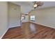 Spacious living room featuring beautiful hardwood floors and a ceiling fan at 2606 Bristlecone Dr, Indianapolis, IN 46217
