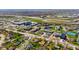 High aerial view showcasing the neighborhood, nearby businesses, commercial area, and highway interchange and overpass at 2753 N High School Rd, Indianapolis, IN 46224