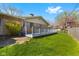 Green backyard with a wooden deck and partial view of the home's exterior at 2753 N High School Rd, Indianapolis, IN 46224