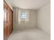 A bedroom with neutral carpet, painted walls, one window and a closet at 2753 N High School Rd, Indianapolis, IN 46224