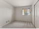 A bedroom with carpet, painted walls, one window, and a closet at 2753 N High School Rd, Indianapolis, IN 46224