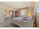 Bedroom showcasing a bed and large closet with sliding mirrored doors at 2753 N High School Rd, Indianapolis, IN 46224