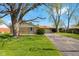 Cozy single-story brick home with a well-maintained lawn, mature trees, and an attached one car garage at 2753 N High School Rd, Indianapolis, IN 46224