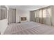 Bright living room features a classic fireplace with white brick surround and neutral carpeting at 2753 N High School Rd, Indianapolis, IN 46224