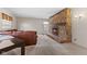 Inviting living room featuring a stone fireplace, cozy leather seating, and natural light at 2753 N High School Rd, Indianapolis, IN 46224