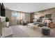 Inviting living room featuring modern furniture, neutral color palette, and ample natural light creating a cozy atmosphere at 2753 N High School Rd, Indianapolis, IN 46224