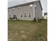 Spacious backyard featuring a patio, well-manicured lawn, and tasteful landscaping, ideal for outdoor enjoyment at 280 Walker Dr, Whiteland, IN 46184