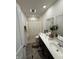 Bright bathroom featuring dual sinks, a modern vanity, stylish mirror, and a shower-tub combination at 280 Walker Dr, Whiteland, IN 46184