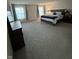 Inviting primary bedroom with large windows, carpet floors, and a comfortable king-sized bed at 280 Walker Dr, Whiteland, IN 46184