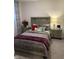 Comfortable bedroom with bedside tables, decorative accents, and a cozy bed at 280 Walker Dr, Whiteland, IN 46184