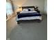 Well-lit bedroom featuring carpet floors, a king-sized bed with plush bedding, and large windows at 280 Walker Dr, Whiteland, IN 46184