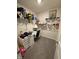 Walk-in closet converted into an office space with shelving, desk, chair, and ample storage for organization at 280 Walker Dr, Whiteland, IN 46184