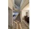 Bright foyer with a staircase, elegant railing, and views into the living and dining areas at 280 Walker Dr, Whiteland, IN 46184