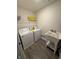 Efficient laundry area with modern washer, dryer, and utility sink at 280 Walker Dr, Whiteland, IN 46184