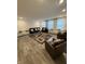Spacious living room with modern flooring, comfortable seating, and natural light at 280 Walker Dr, Whiteland, IN 46184
