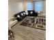Spacious living room with dark furniture, light walls, and modern decor at 280 Walker Dr, Whiteland, IN 46184