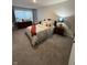 Comfortable bedroom featuring a bed with decorative pillows, a dresser, and a large window for natural light at 280 Walker Dr, Whiteland, IN 46184