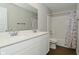Bright bathroom boasts a double sink vanity with modern fixtures and a shower-tub combination at 321 Bluestem Ln, Whiteland, IN 46184