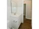 Bathroom featuring white subway tile, granite countertop and wood-look floor at 321 Bluestem Ln, Whiteland, IN 46184