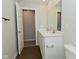 The bathroom has a modern double sink vanity, wood-look tile, and an open closet space at 321 Bluestem Ln, Whiteland, IN 46184