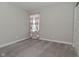 This carpeted bedroom features white trim, a window with curtains, and lots of natural light at 321 Bluestem Ln, Whiteland, IN 46184