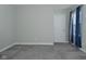 This bedroom offers neutral walls, plush carpeting, and a bright window for a calming retreat at 321 Bluestem Ln, Whiteland, IN 46184