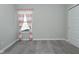 Neutral bedroom offers wall to wall carpeting, a window, and white trim for a clean design at 321 Bluestem Ln, Whiteland, IN 46184