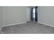 Bedroom with neutral carpet, gray walls, and window with blue curtains at 321 Bluestem Ln, Whiteland, IN 46184