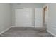 Bedroom with carpet and closet space featuring sliding doors, offers ample storage at 321 Bluestem Ln, Whiteland, IN 46184