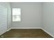 Bright, spacious bedroom with vinyl flooring and window with view to the neighborhood at 321 Bluestem Ln, Whiteland, IN 46184