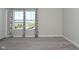 Bedroom with neutral carpet, gray walls, and window with patterned curtains at 321 Bluestem Ln, Whiteland, IN 46184