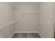 Walk-in closet with carpet and wire shelving, offering plentiful storage in an organized and clean space at 321 Bluestem Ln, Whiteland, IN 46184