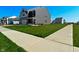 Suburban two-story home with lush green lawn, sidewalk, and beautiful landscaping at 321 Bluestem Ln, Whiteland, IN 46184