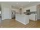 Modern kitchen with white cabinets, stainless steel appliances, and a central island at 321 Bluestem Ln, Whiteland, IN 46184