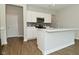 Beautiful kitchen island with a view of stainless steel appliances and mosaic backsplash at 321 Bluestem Ln, Whiteland, IN 46184