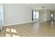 Spacious and bright living room with large window and view of entryway and kitchen at 321 Bluestem Ln, Whiteland, IN 46184