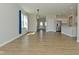Open-concept living space with dining area, kitchen and stainless steel appliances at 321 Bluestem Ln, Whiteland, IN 46184