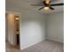 A cozy bedroom features plush carpeting and a ceiling fan for comfort at 3333 Lupine Dr, Indianapolis, IN 46224