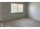 Clean and simple bedroom with neutral paint, new carpet and a nice street view through the blinds at 3333 Lupine Dr, Indianapolis, IN 46224