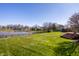 Green backyard with a view of the lake at 3634 W 58Th St, Indianapolis, IN 46228