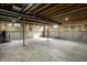Unfinished basement featuring concrete floors and walls with visible ceiling beams and support columns at 3634 W 58Th St, Indianapolis, IN 46228