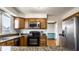 Kitchen with stainless steel appliances, granite countertops, and oak cabinets at 3634 W 58Th St, Indianapolis, IN 46228